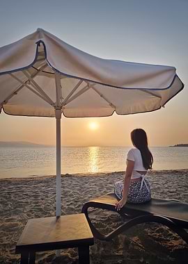 Woman on beach at sunset