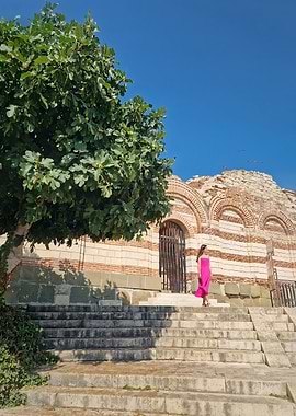 Woman in Pink Dress by Ruins of Nesebar