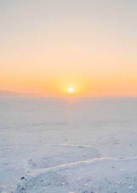 Sunrise over a vast white landscape