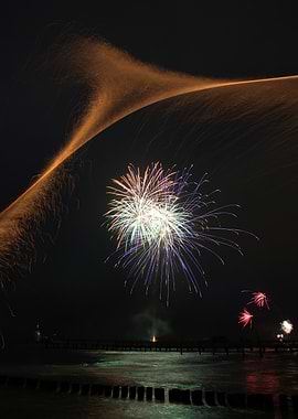Fireworks Display over Water at Night