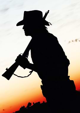 Silhouette of a Cowboy with Rifle