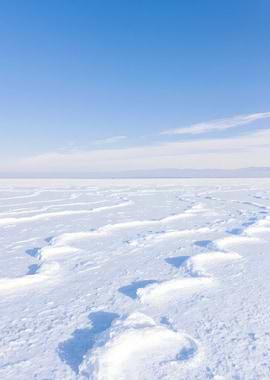 Snowy Landscape with Footprints and Sky