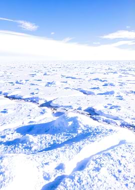 Endless Snowy Landscape Under Blue Sky