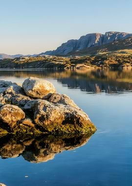 Still Lake with Rock Formation
