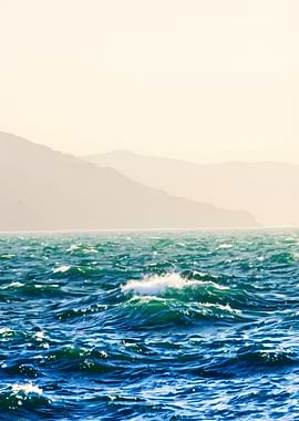 Ocean Waves with Mountain Backdrop