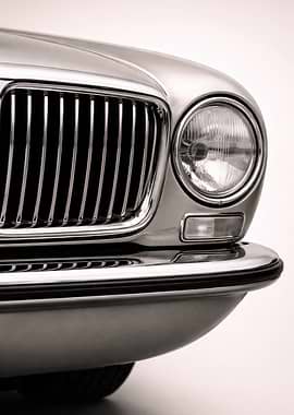 Close-up of a vintage car grille and headlight - European Sports Sedan