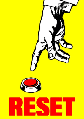 Hand pressing a red reset button