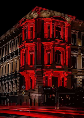Building illuminated by red light at night