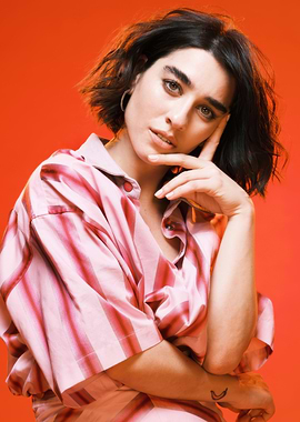 simona tabasco in striped shirt against red background