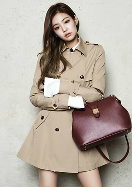 Jennie Kim in a Trench Coat with Handbag
