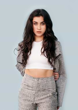 lauren jauregui in patterned outfit against blue background