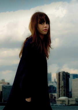 diane birch in dark coat against city skyline