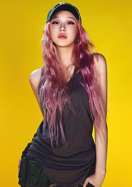 Woman with pink hair and cap aespa