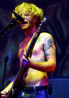 Shirtless Musician Playing Guitar