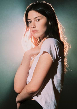 Gracie Abrams in White T-shirt with Dramatic Lighting