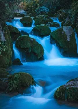 Mossy Rocks in a Blue Waterfall