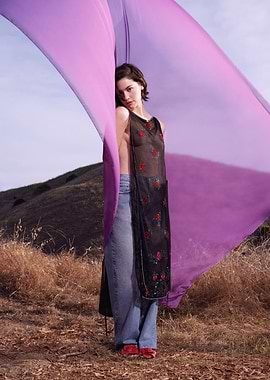 Gracie Abrams in sheer dress with floral print