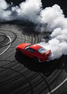 Red car drifting with smoke