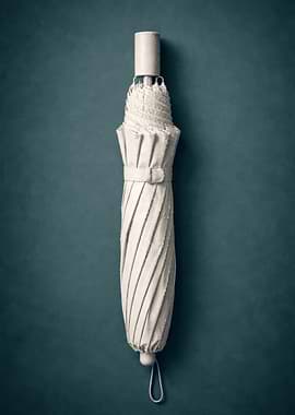 Closed White Umbrella on Teal Background