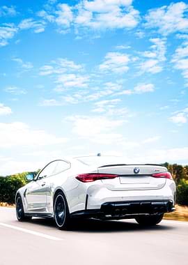 White BMW M4 Driving on Road