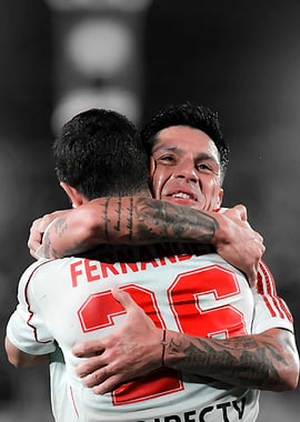 Football players celebrating a goal