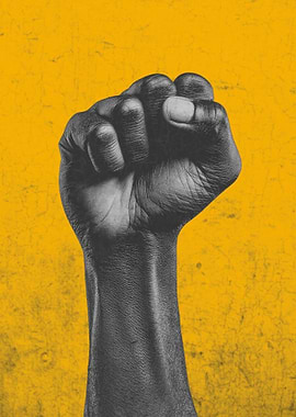 Raised Fist Against Yellow Background