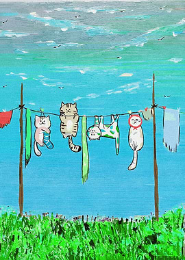 Cats hanging on a clothesline