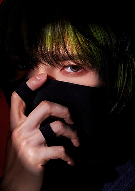 Close-up of a ateez with green-streaked hair