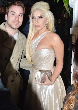 Lady Gaga and companion