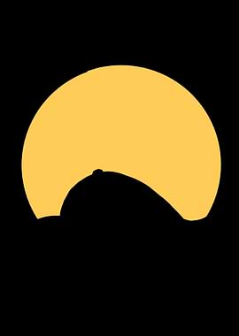 Sun behind a dark hill