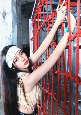 rora babymonster Poses with Red Netting