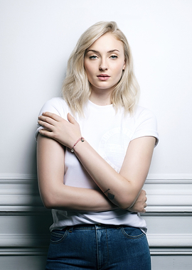 Sophie Turner Posing Against White Wall