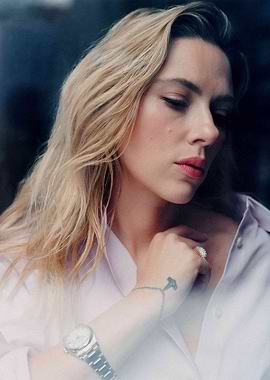 Woman in a light purple shirt with jewelry