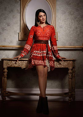 kiara advani in Red Dress Posing by Table