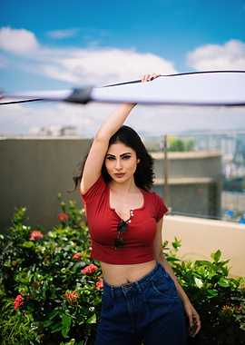 Mouni Roy in red crop top and jeans