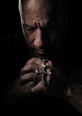 Vin Diesel praying with cross necklace
