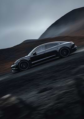 Black Porsche Taycan on a Dark Landscape