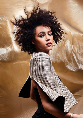 Nathalie Emmanuel with Curly Hair and Embellished Top