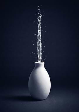 Water Splashing from White Vase