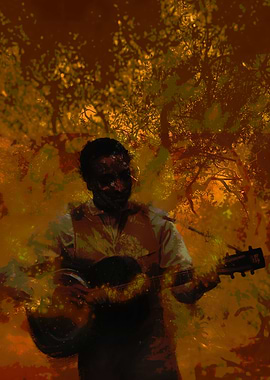 Musician playing guitar in nature