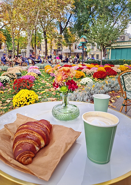 Autumn cafe scene with coffee and croissant