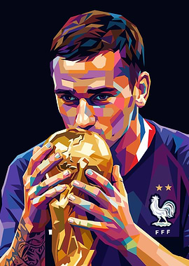 Antoine Griezmann kissing World Cup trophy