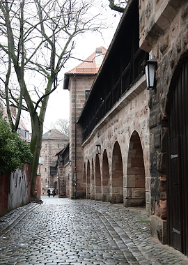 Cobblestone Alley with Arched Wall