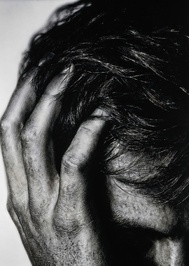 Hand Grasping Dark Messy Hair