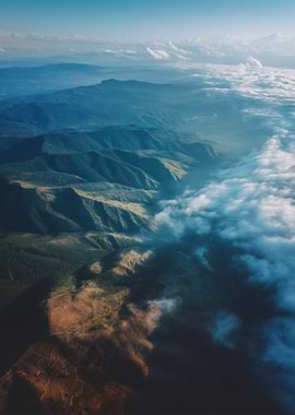 Aerial View of Mountain Range and Clouds
