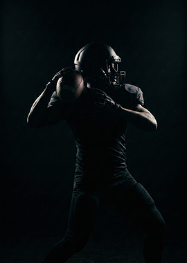 Football Player Throwing Ball