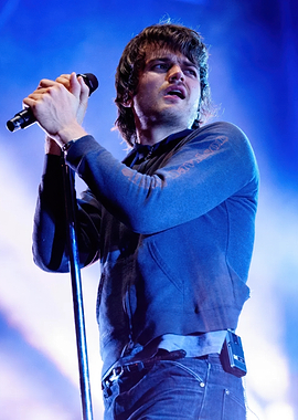 Singer performing on stage djo joe keery