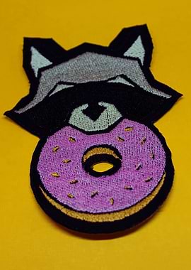 Raccoon Eating a Donut Patch