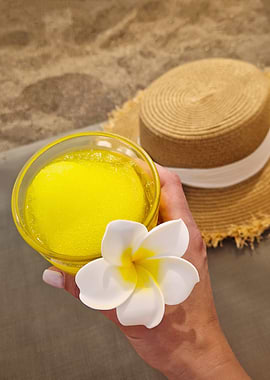 Tropical drink with flower and hat