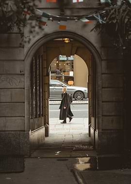 Woman walking through an archway